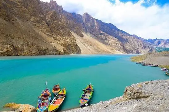 Colourful boats on the turquoise water of Attabad Lake in Hunza