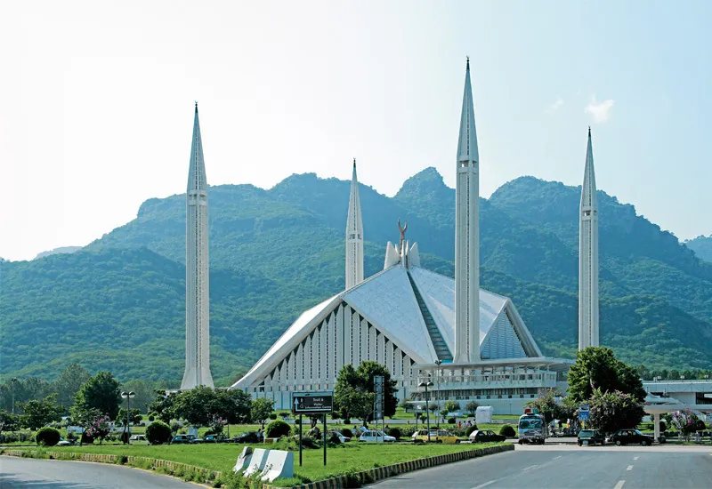 Faisal Mosque with its four minarets in front of the Margalla Hills, Islamabad