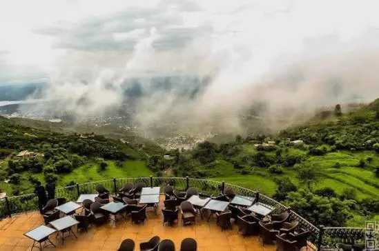 Terrace cafe with tables above the clouds at Pir Sohawa in the Margalla Hills